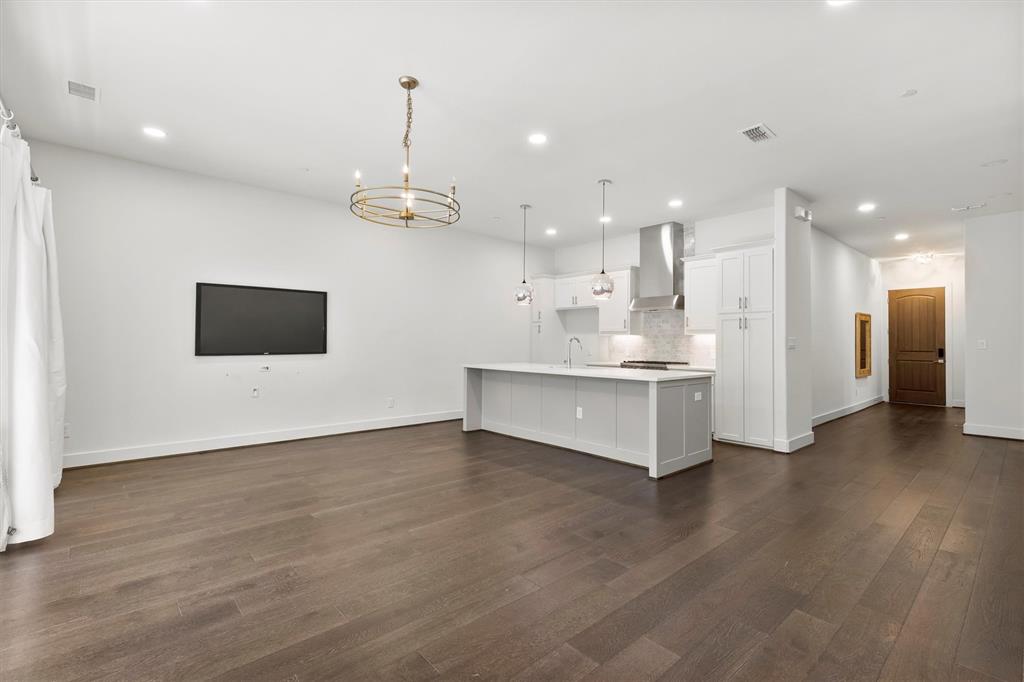 15875 Spectrum Drive, Unit 1106 Addison, TX 75001 - Photo 39 of 39 a view of kitchen with stainless steel appliances kitchen island a refrigerator and a stove top oven