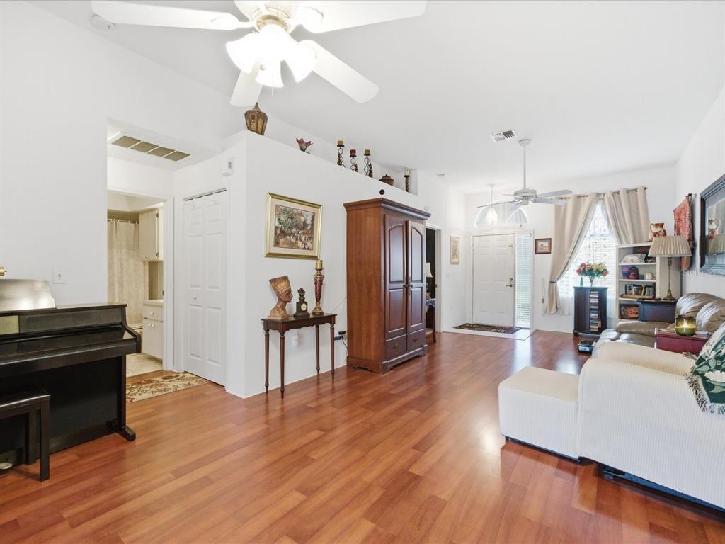 4209 Avanti Circle New Port Richey, FL 34655 - Photo 11 of 35 a living room with furniture and a wooden floor