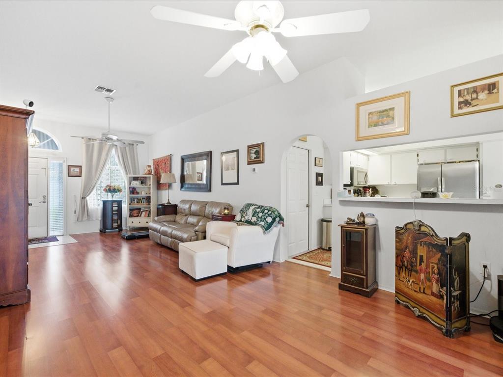 4209 Avanti Circle New Port Richey, FL 34655 - Photo 12 of 35 a living room with furniture and a wooden floor