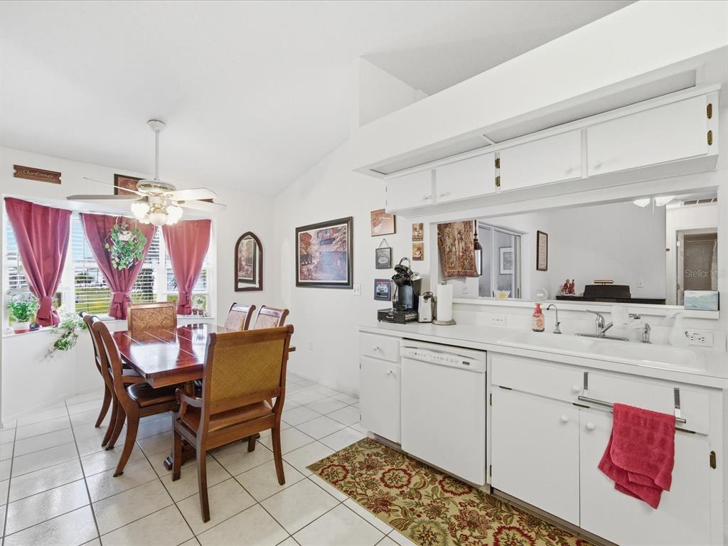 4209 Avanti Circle New Port Richey, FL 34655 - Photo 19 of 35 a kitchen with stainless steel appliances kitchen island granite countertop a sink and cabinets