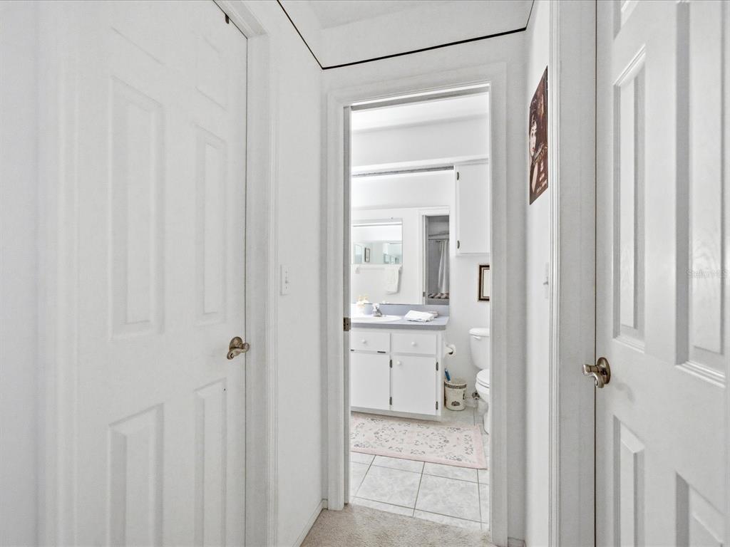 4209 Avanti Circle New Port Richey, FL 34655 - Photo 29 of 35 a en suite bathroom with a granite countertop sink and a mirror
