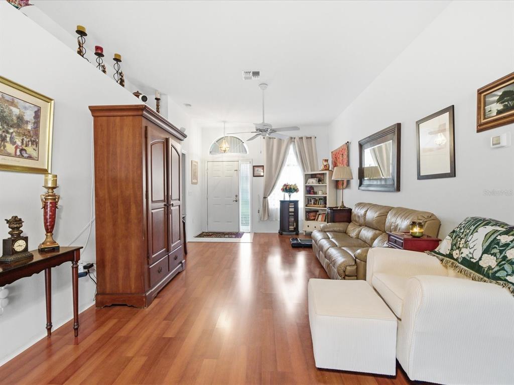 4209 Avanti Circle New Port Richey, FL 34655 - Photo 3 of 35 a living room with furniture and wooden floor