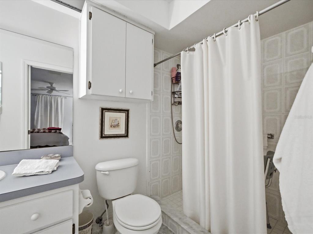 4209 Avanti Circle New Port Richey, FL 34655 - Photo 31 of 35 a white toilet sitting next to a bathroom sink