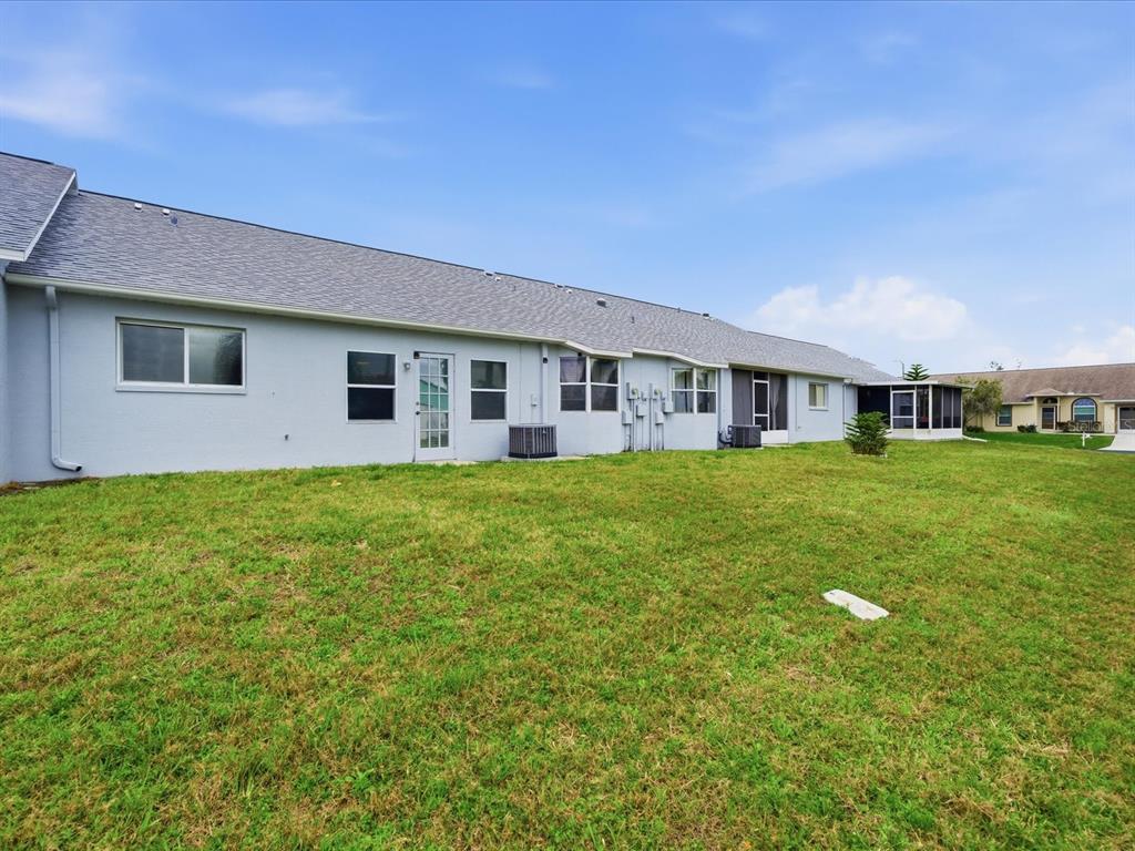 4209 Avanti Circle New Port Richey, FL 34655 - Photo 34 of 35 a house view with a garden space