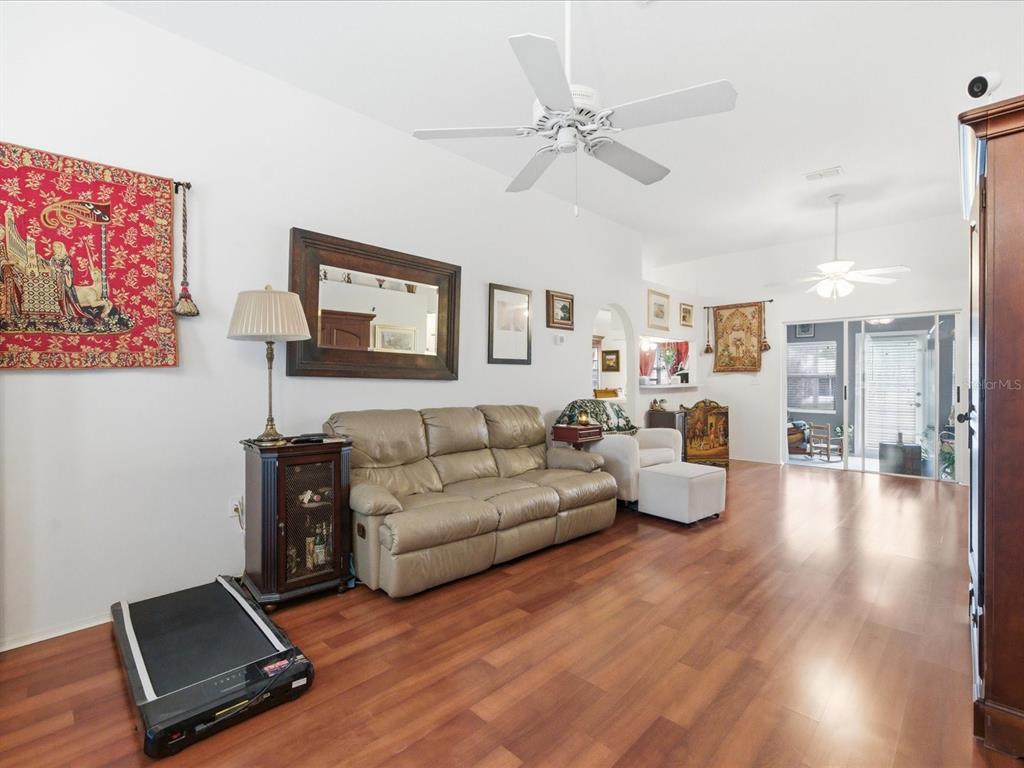 4209 Avanti Circle New Port Richey, FL 34655 - Photo 4 of 35 a living room with furniture and a wooden floor