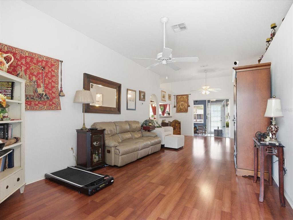 4209 Avanti Circle New Port Richey, FL 34655 - Photo 8 of 35 a living room with furniture and wooden floor