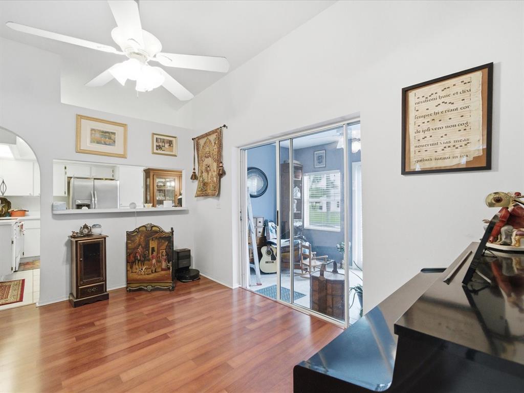 4209 Avanti Circle New Port Richey, FL 34655 - Photo 10 of 35 a living room with furniture and a flat screen tv