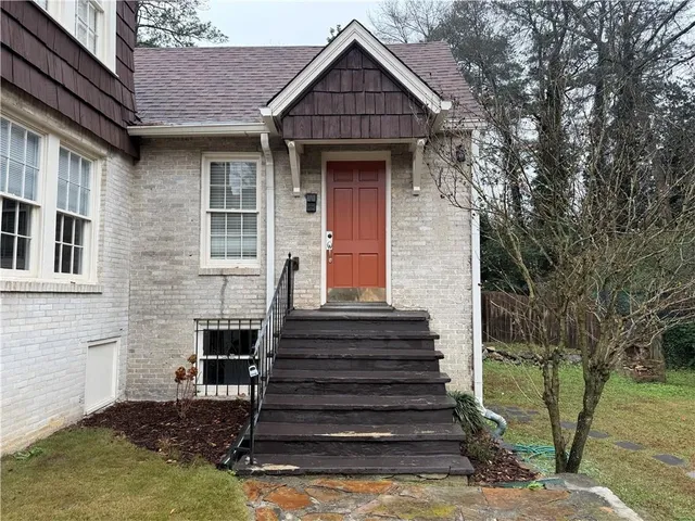 a front view of a house with a small yard