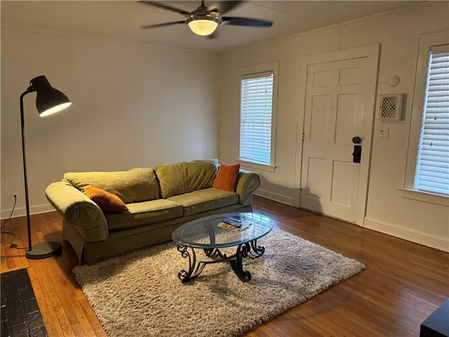 a living room with furniture and a rug