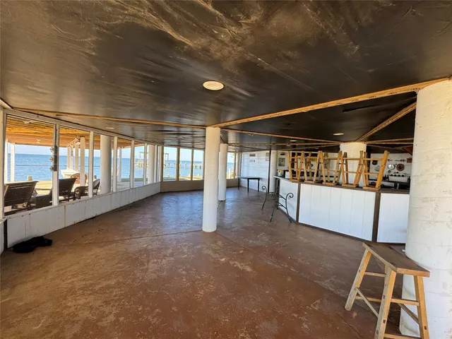 a garage with a stove and a wooden floors