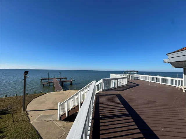 an aerial view of a house with garden space and balcony