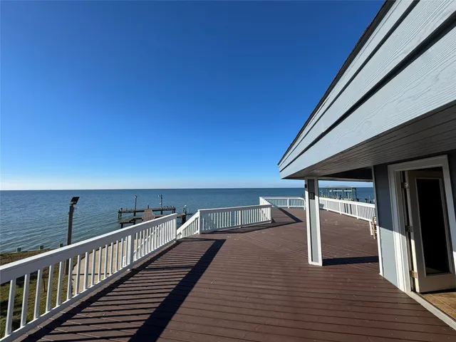 a view of a balcony with wooden floor