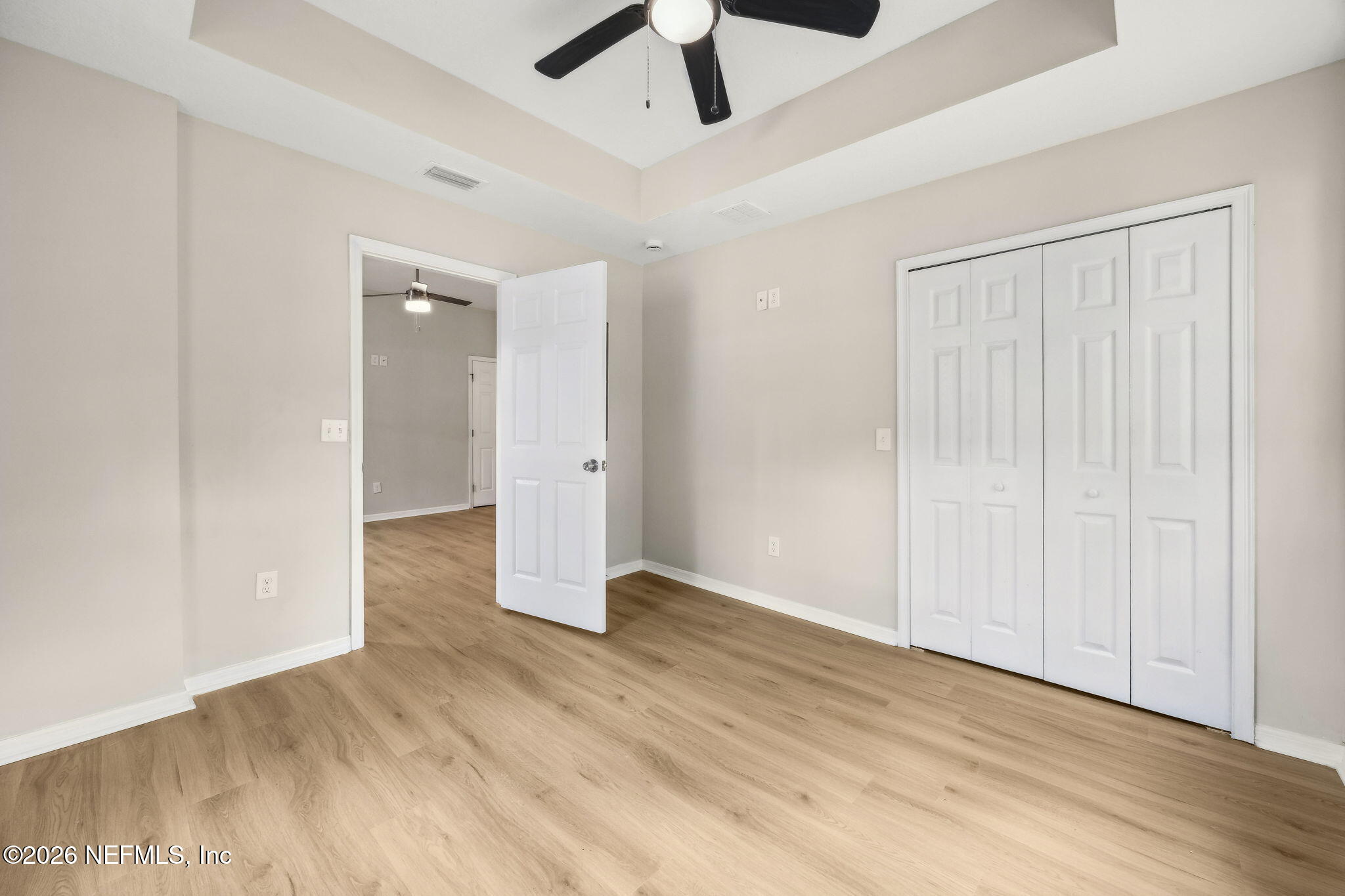 2562 Summit Street Jacksonville, FL 32204 - Photo 15 of 20 wooden floor in an empty room with a ceiling fan