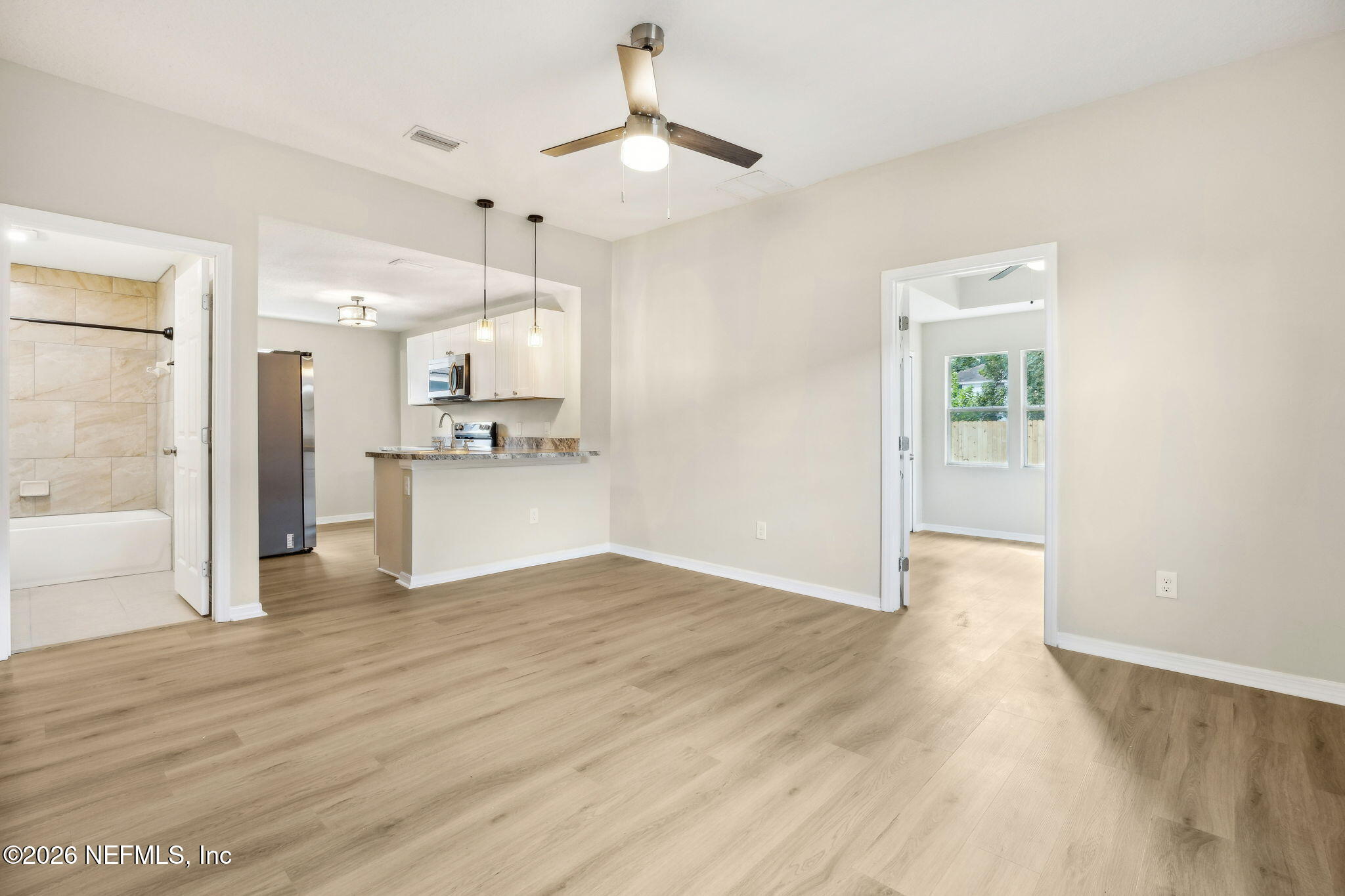 2562 Summit Street Jacksonville, FL 32204 - Photo 5 of 20 a view of a kitchen with wooden floor and a kitchen