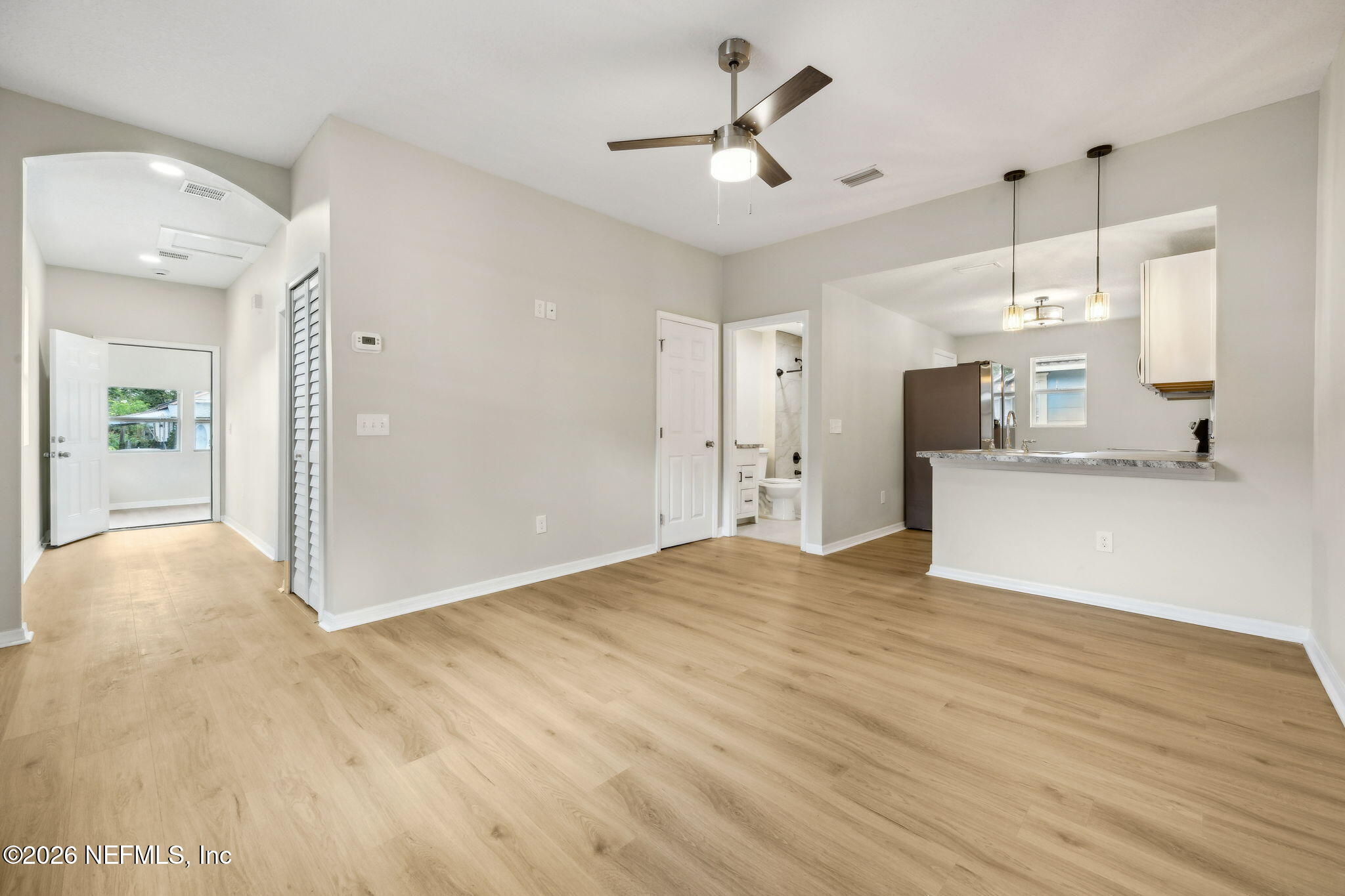 2562 Summit Street Jacksonville, FL 32204 - Photo 6 of 20 a view of a kitchen with a sink and a refrigerator