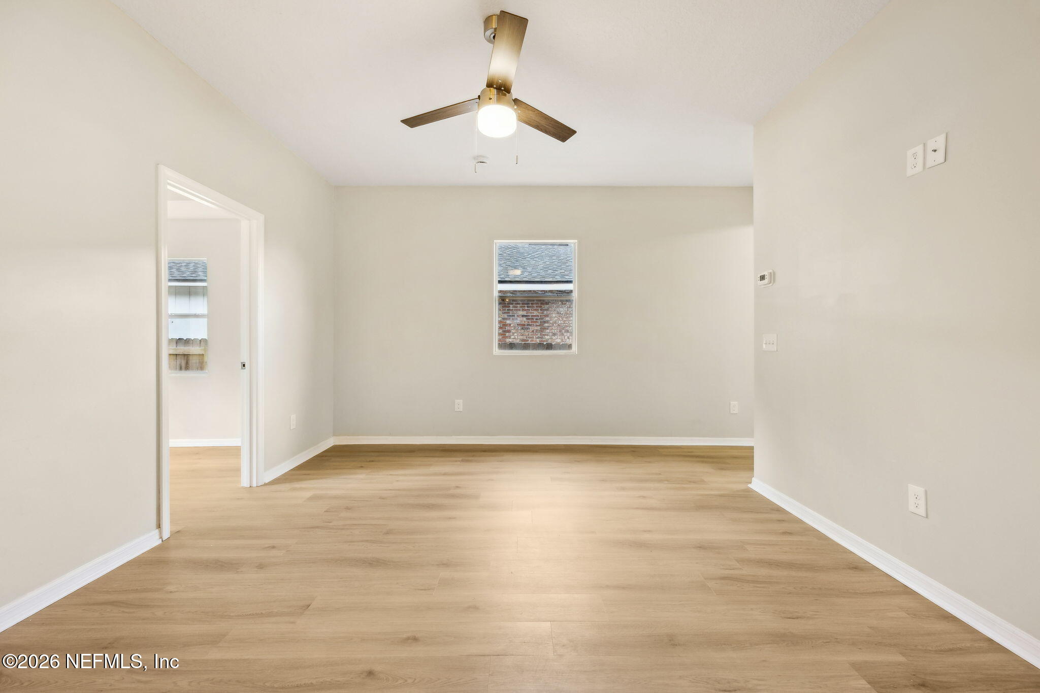 2562 Summit Street Jacksonville, FL 32204 - Photo 7 of 20 a view of an empty room with window and wooden floor