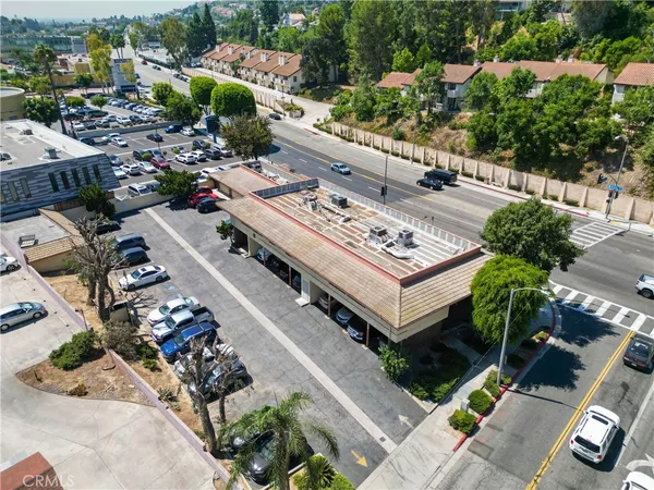 an aerial view of a house with outdoor space