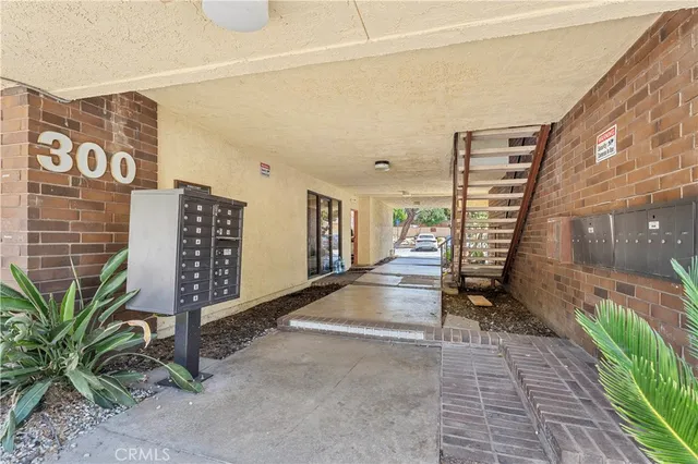 a view of a patio with wooden fence and plants