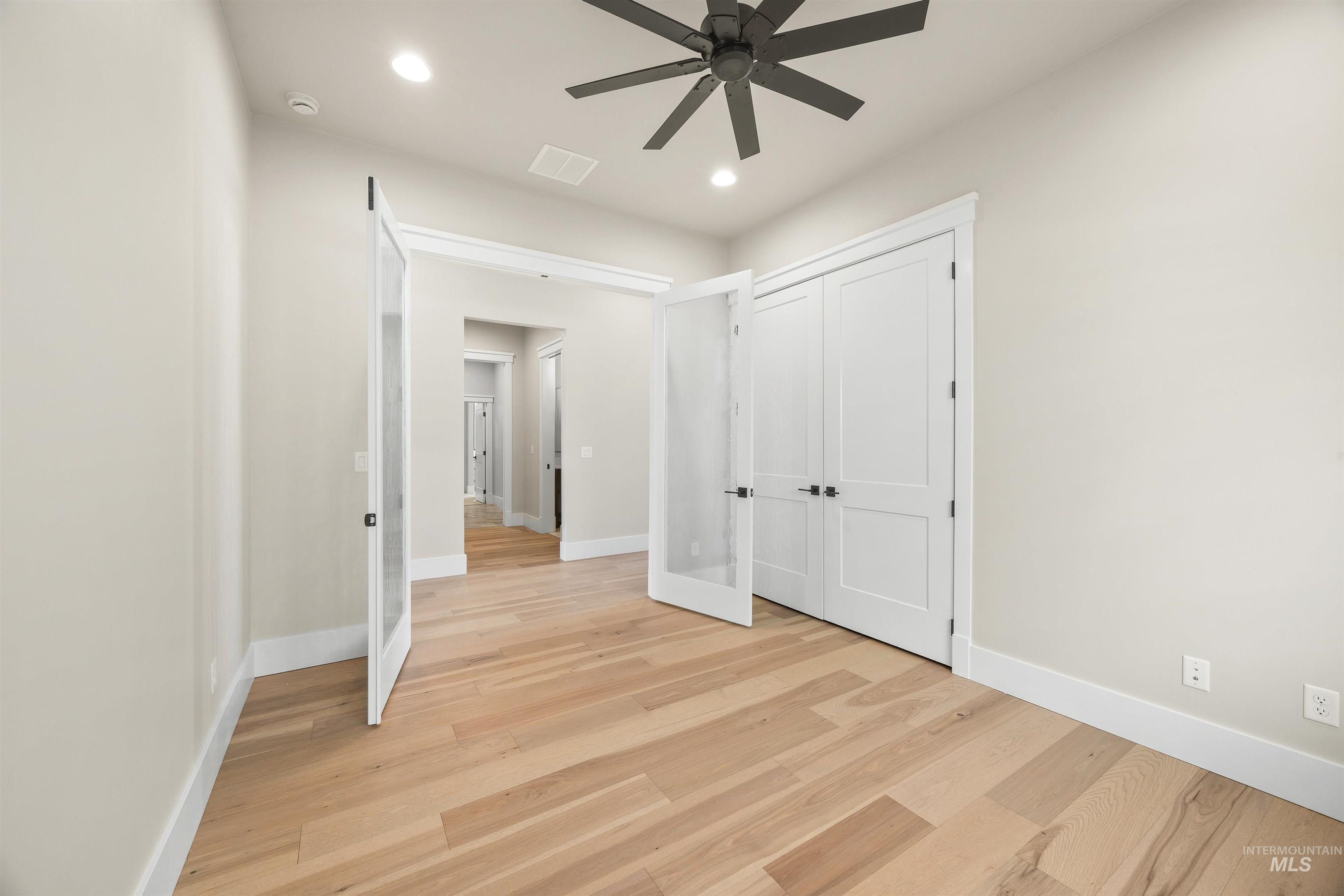 1126 East Crescendo Street Meridian, ID 83642 - Photo 11 of 48 Unfurnished bedroom featuring light wood-type flooring, a ceiling fan, recessed lighting, and a closet