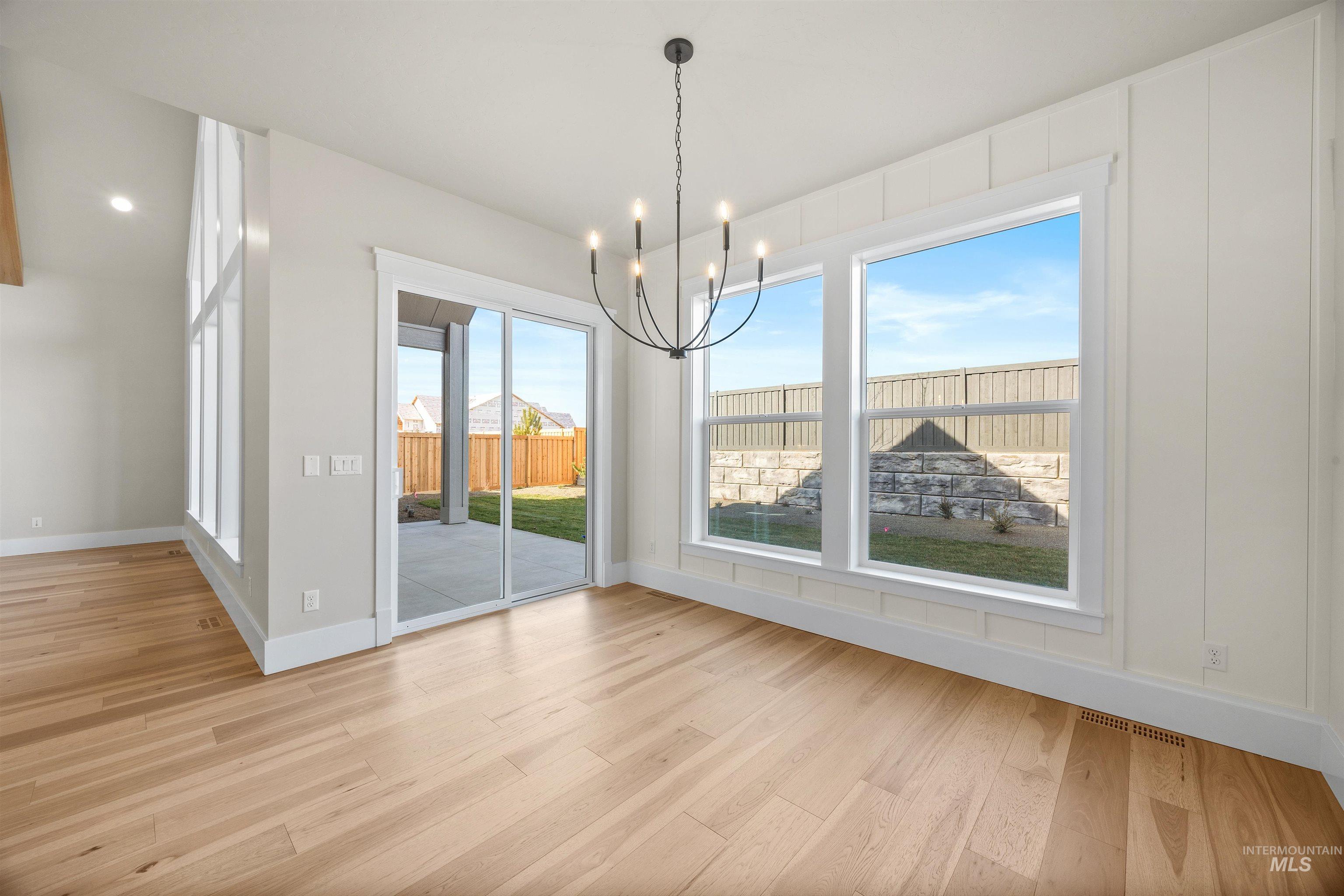1126 East Crescendo Street Meridian, ID 83642 - Photo 15 of 48 Unfurnished dining area featuring suspended lighting and light wood-style floors