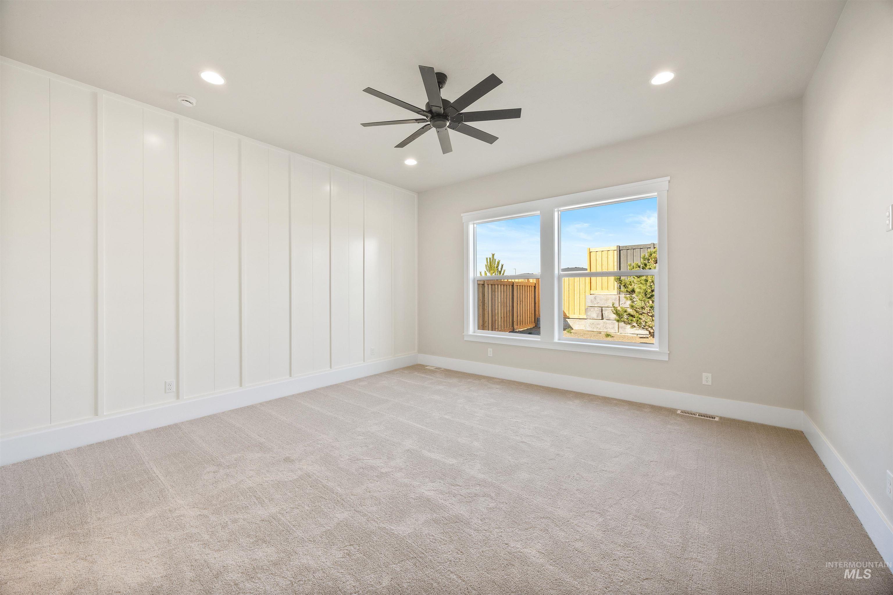 1126 East Crescendo Street Meridian, ID 83642 - Photo 28 of 48 Unfurnished room featuring light carpet, recessed lighting, and a ceiling fan