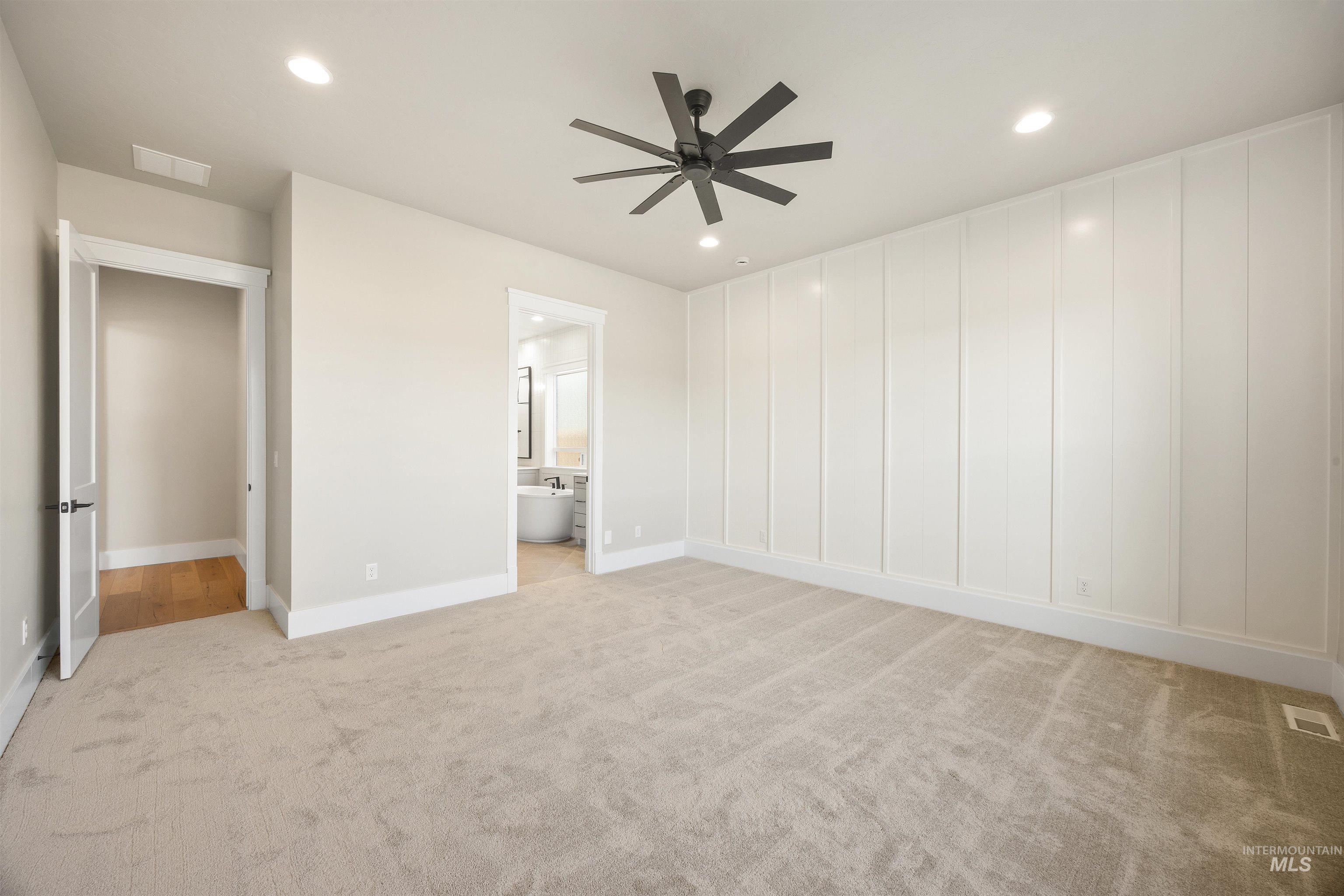 1126 East Crescendo Street Meridian, ID 83642 - Photo 29 of 48 Unfurnished bedroom with light carpet, recessed lighting, a ceiling fan, and ensuite bath