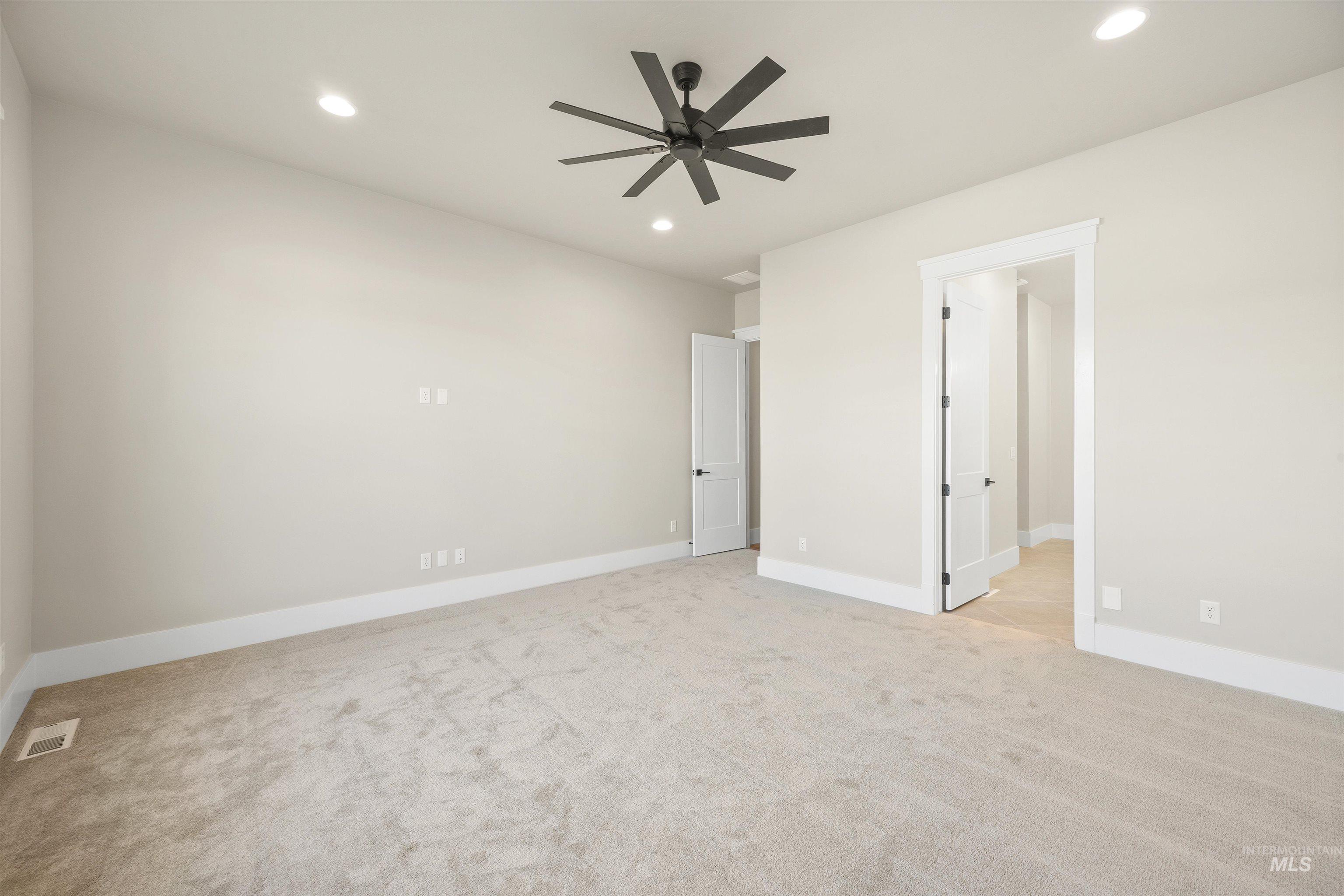 1126 East Crescendo Street Meridian, ID 83642 - Photo 30 of 48 Unfurnished bedroom with light colored carpet, recessed lighting, and ceiling fan