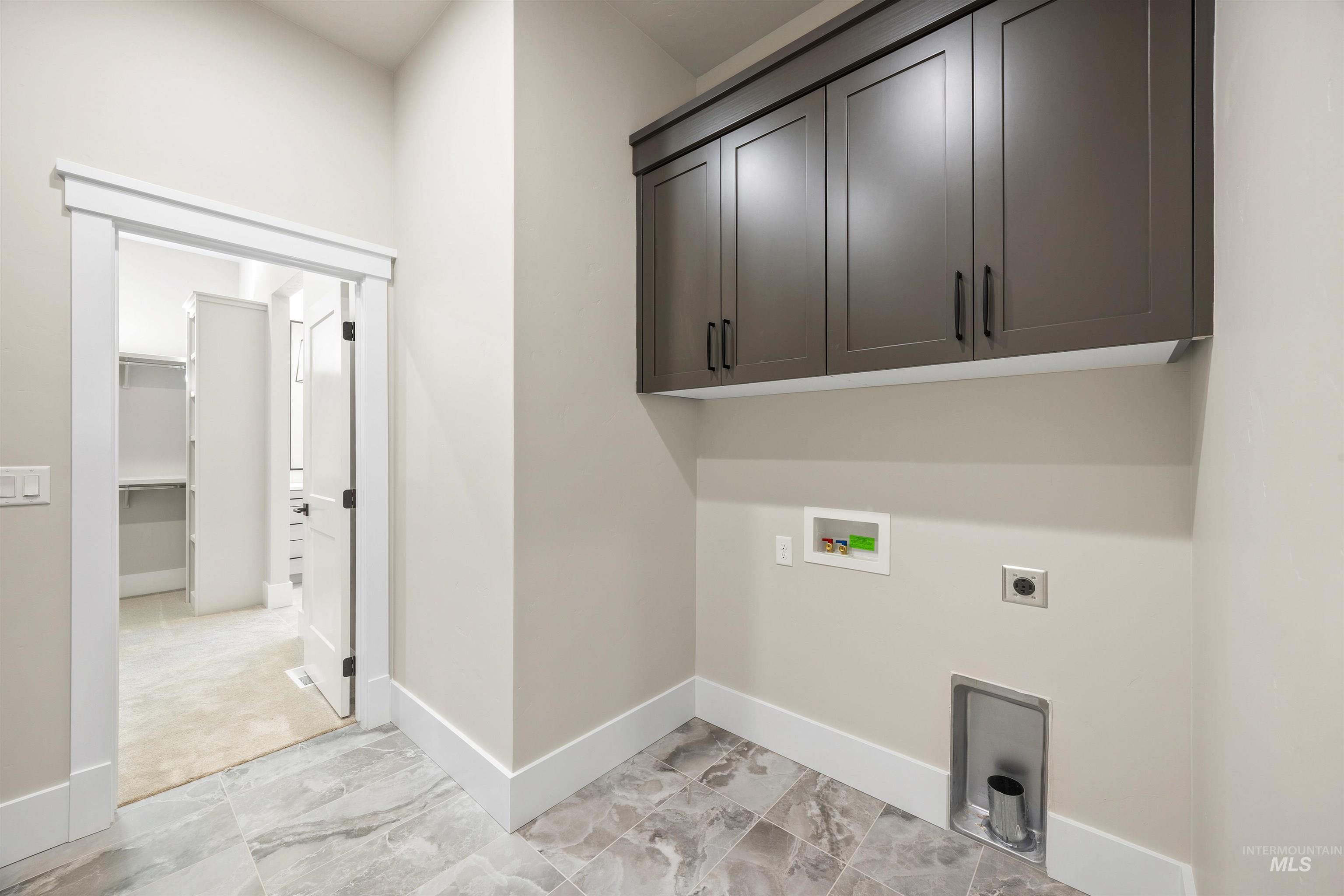 1126 East Crescendo Street Meridian, ID 83642 - Photo 37 of 48 Laundry area featuring cabinet space, hookup for a washing machine, and electric dryer hookup
