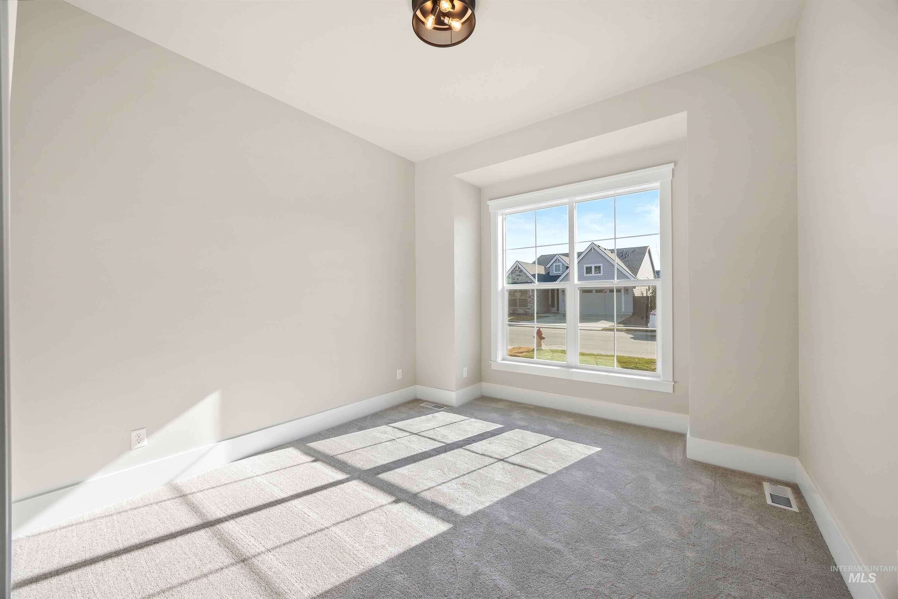 1126 East Crescendo Street Meridian, ID 83642 - Photo 5 of 48 Unfurnished room with baseboards and carpet floors