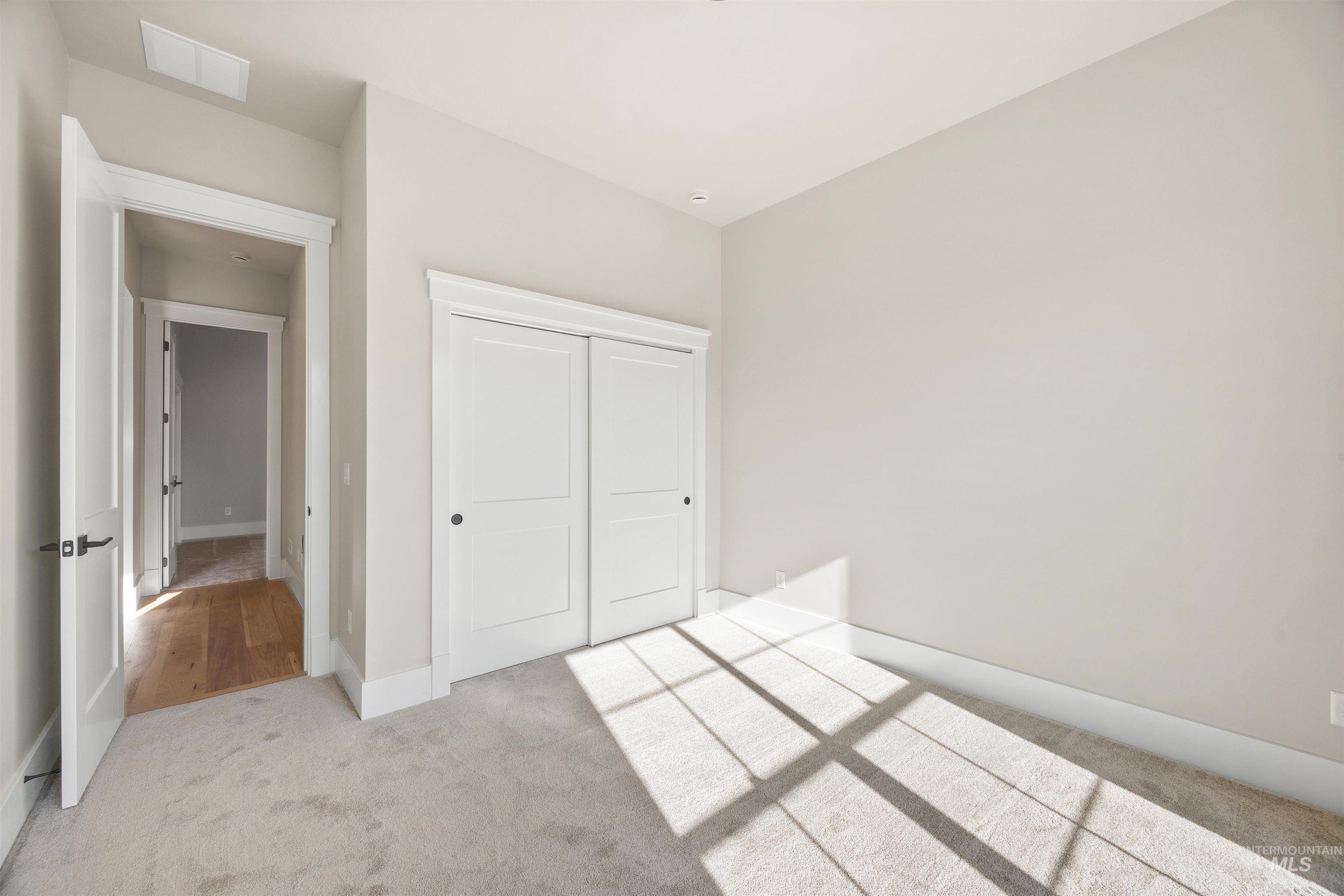 1126 East Crescendo Street Meridian, ID 83642 - Photo 6 of 48 Unfurnished bedroom with carpet floors and a closet