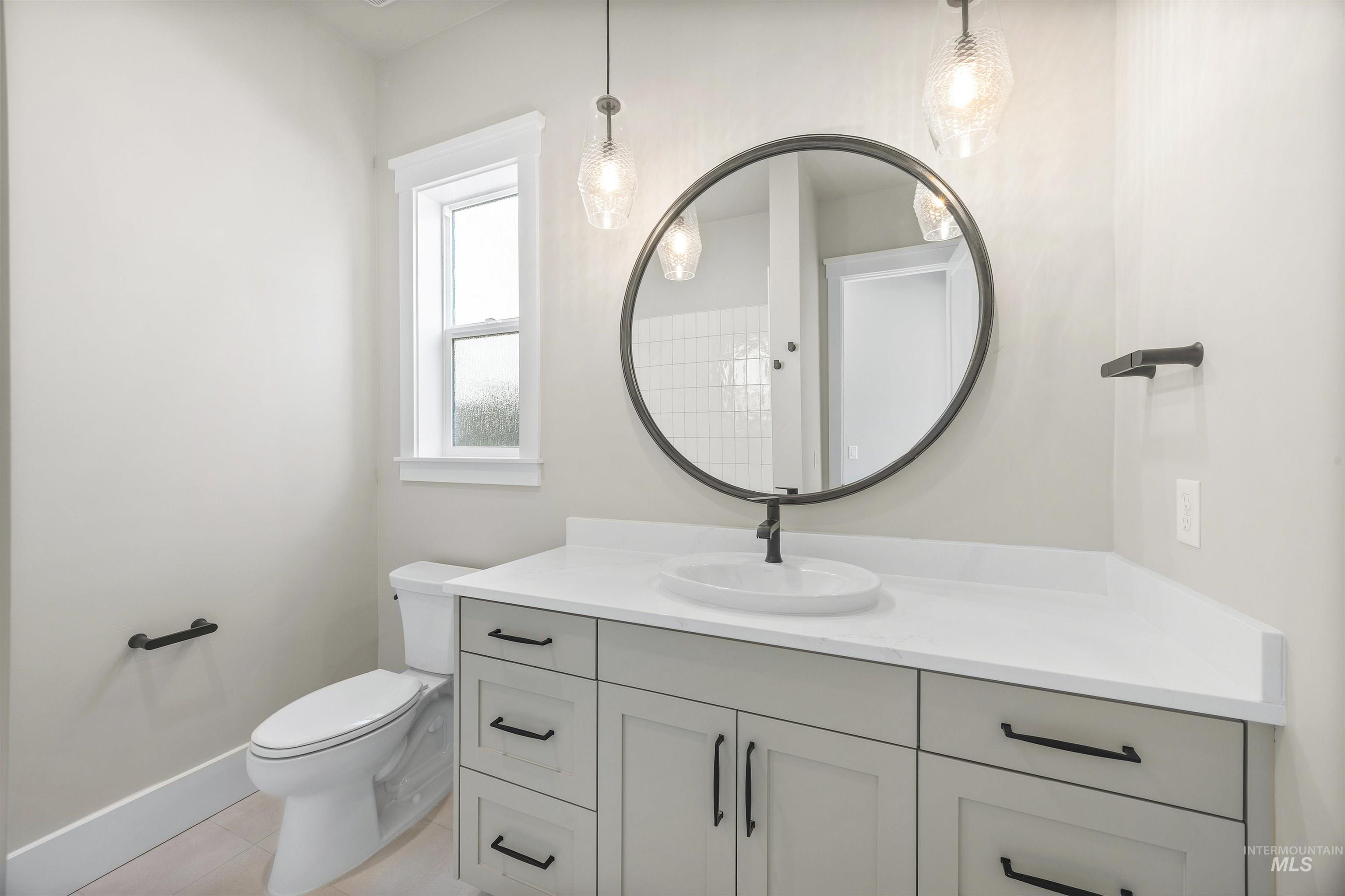 1126 East Crescendo Street Meridian, ID 83642 - Photo 7 of 48 Bathroom featuring vanity and light tile patterned floors