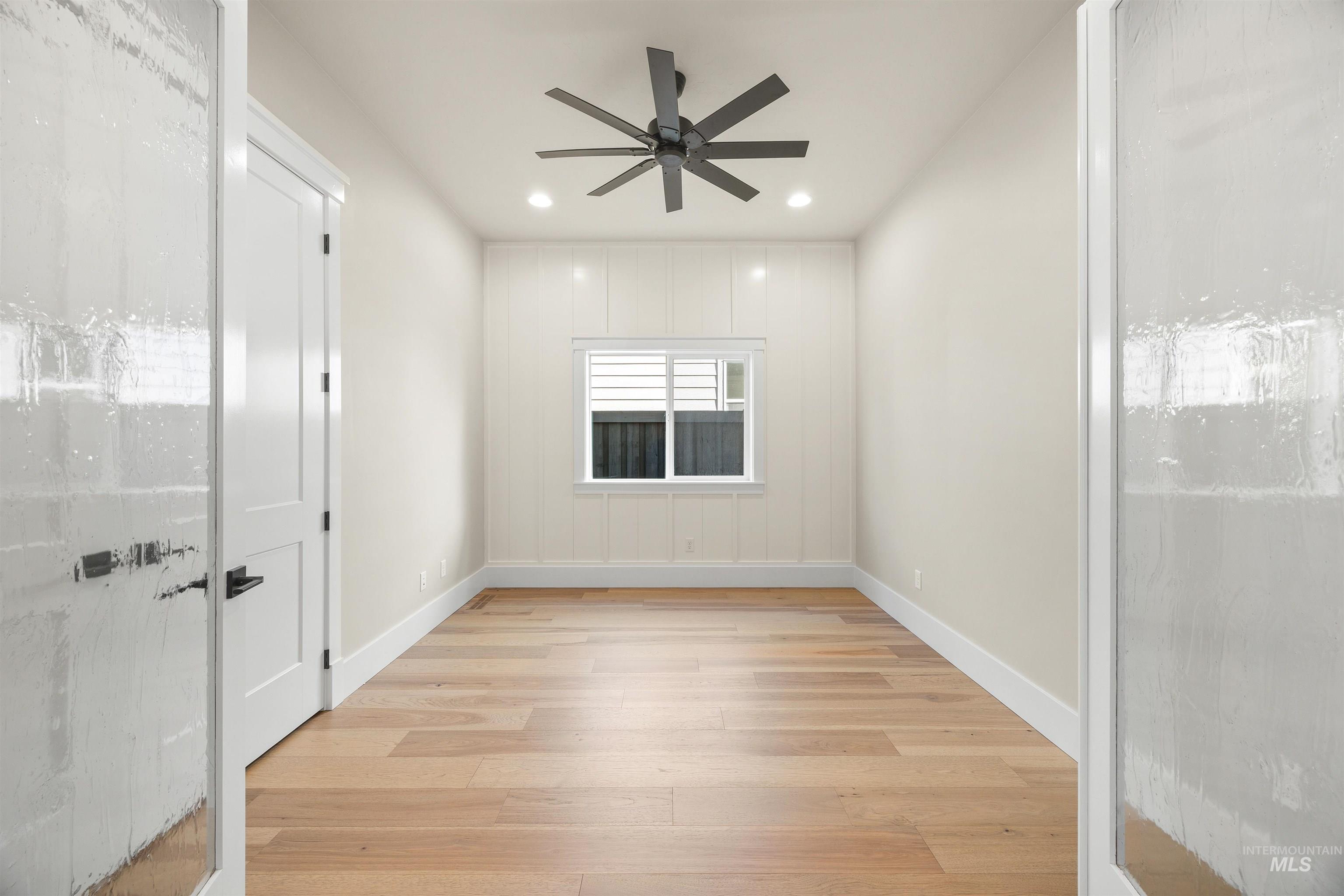 1126 East Crescendo Street Meridian, ID 83642 - Photo 10 of 48 Empty room with light wood-type flooring, ceiling fan, and recessed lighting