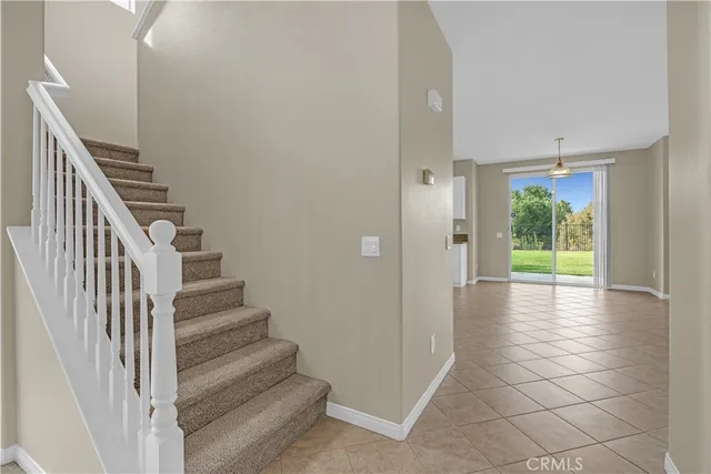 a view of a hallway view with wooden floor and staircase