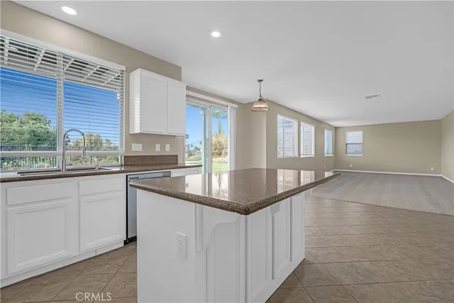 a close view of a stove a microwave and cabinets