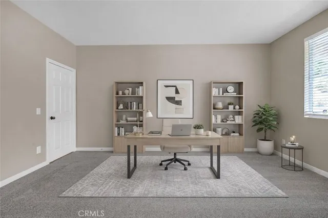 a workspace with furniture and window