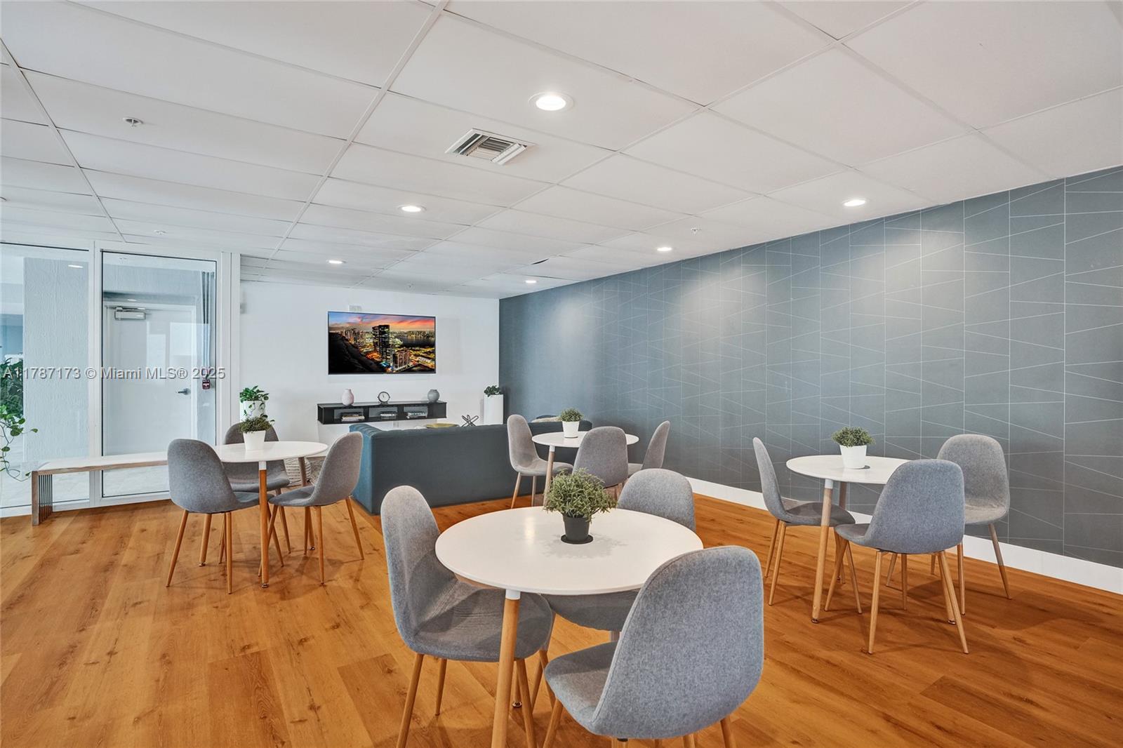 170 Southeast 14th Street, Unit 2907 Miami, FL 33131 - Photo 21 of 30 a view of a dining room with furniture and wooden floor