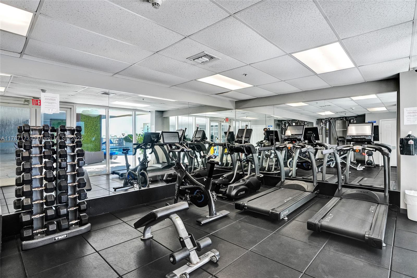 170 Southeast 14th Street, Unit 2907 Miami, FL 33131 - Photo 23 of 30 a view of a room with gym equipment