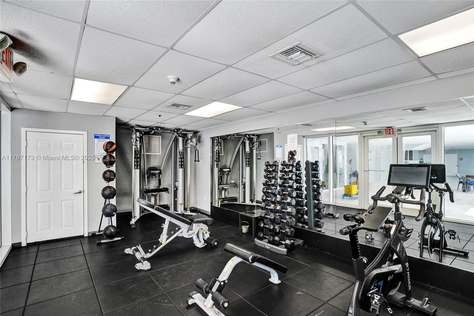 170 Southeast 14th Street, Unit 2907 Miami, FL 33131 - Photo 24 of 30 a view of a room with gym equipment