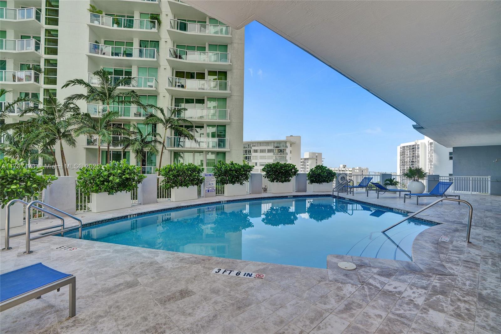 170 Southeast 14th Street, Unit 2907 Miami, FL 33131 - Photo 26 of 30 a swimming pool with outdoor seating and yard