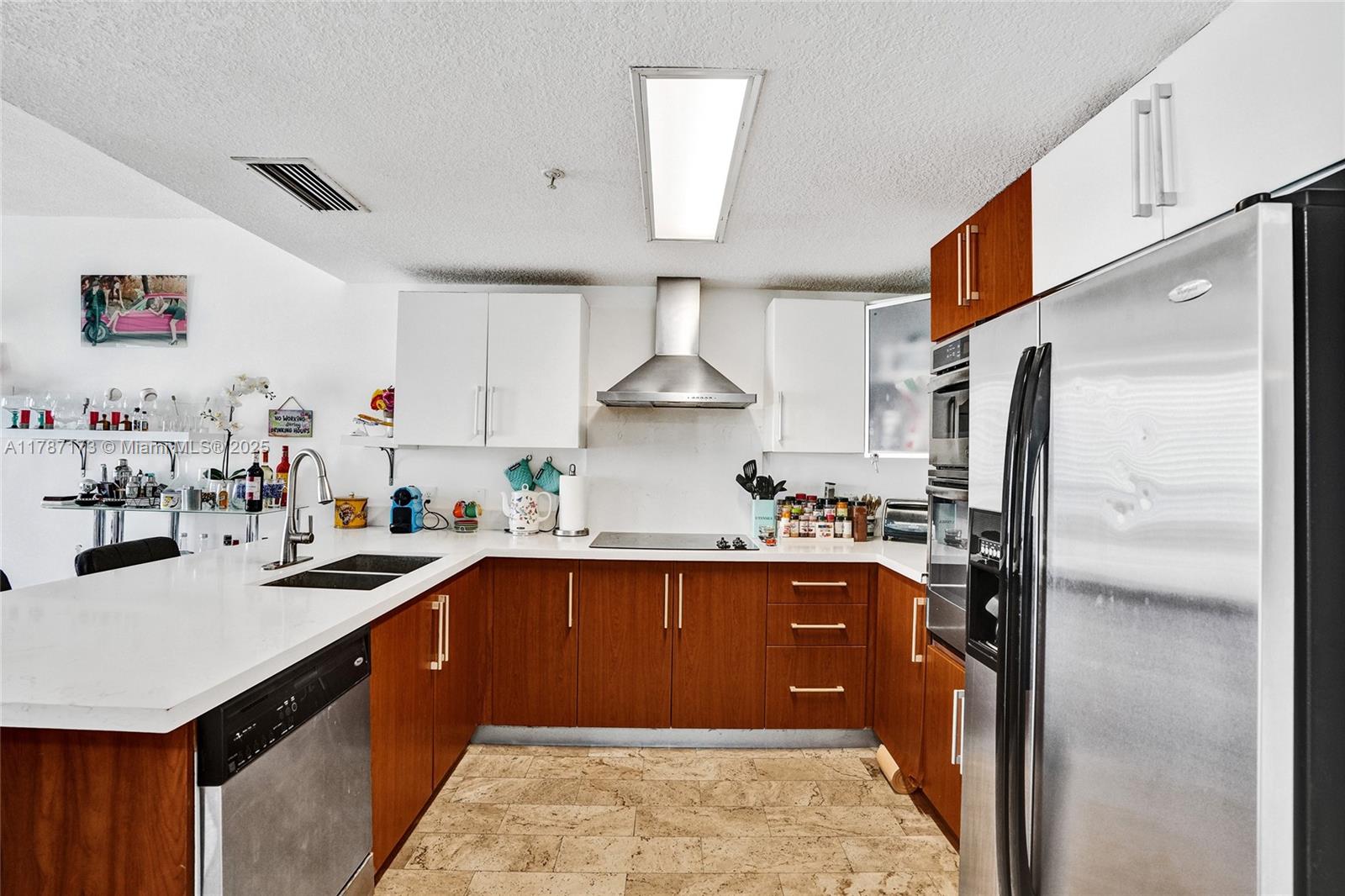 170 Southeast 14th Street, Unit 2907 Miami, FL 33131 - Photo 5 of 30 a kitchen with stainless steel appliances granite countertop a sink stove and refrigerator