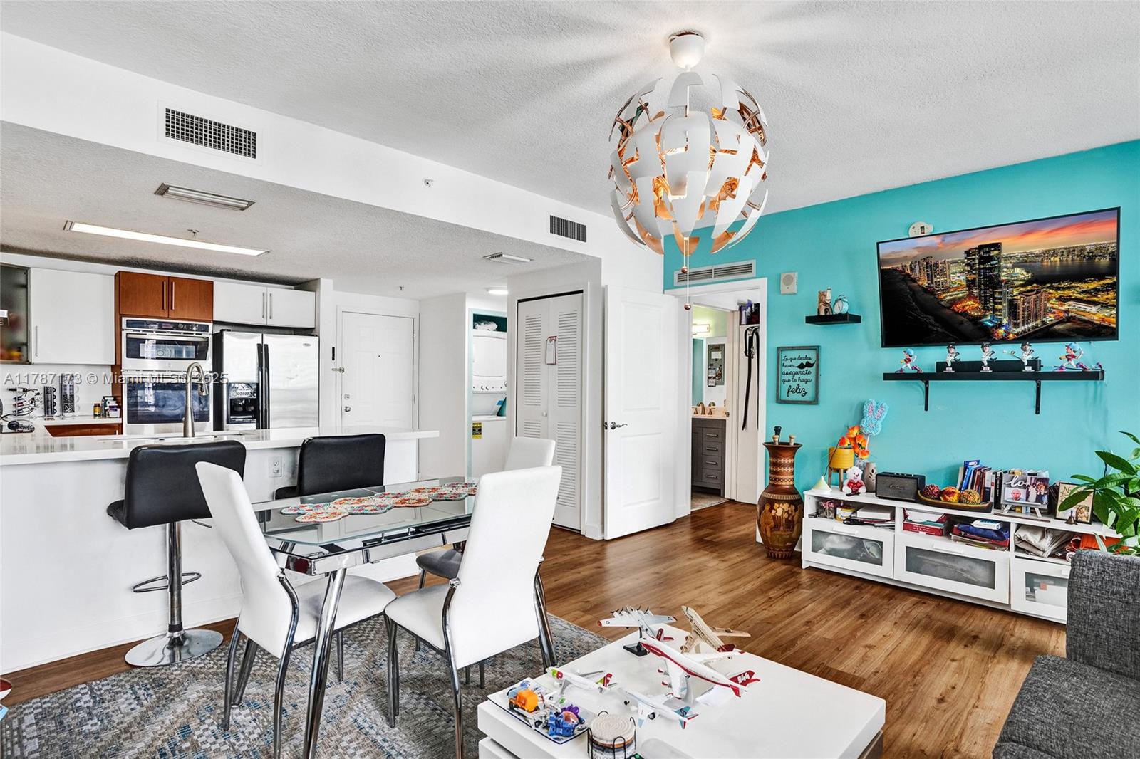 170 Southeast 14th Street, Unit 2907 Miami, FL 33131 - Photo 7 of 30 a living room with furniture and a flat screen tv