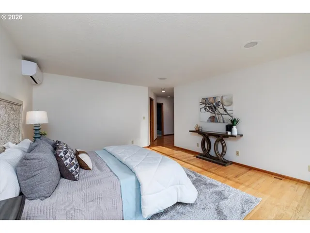 a bedroom with a bed and a table in it