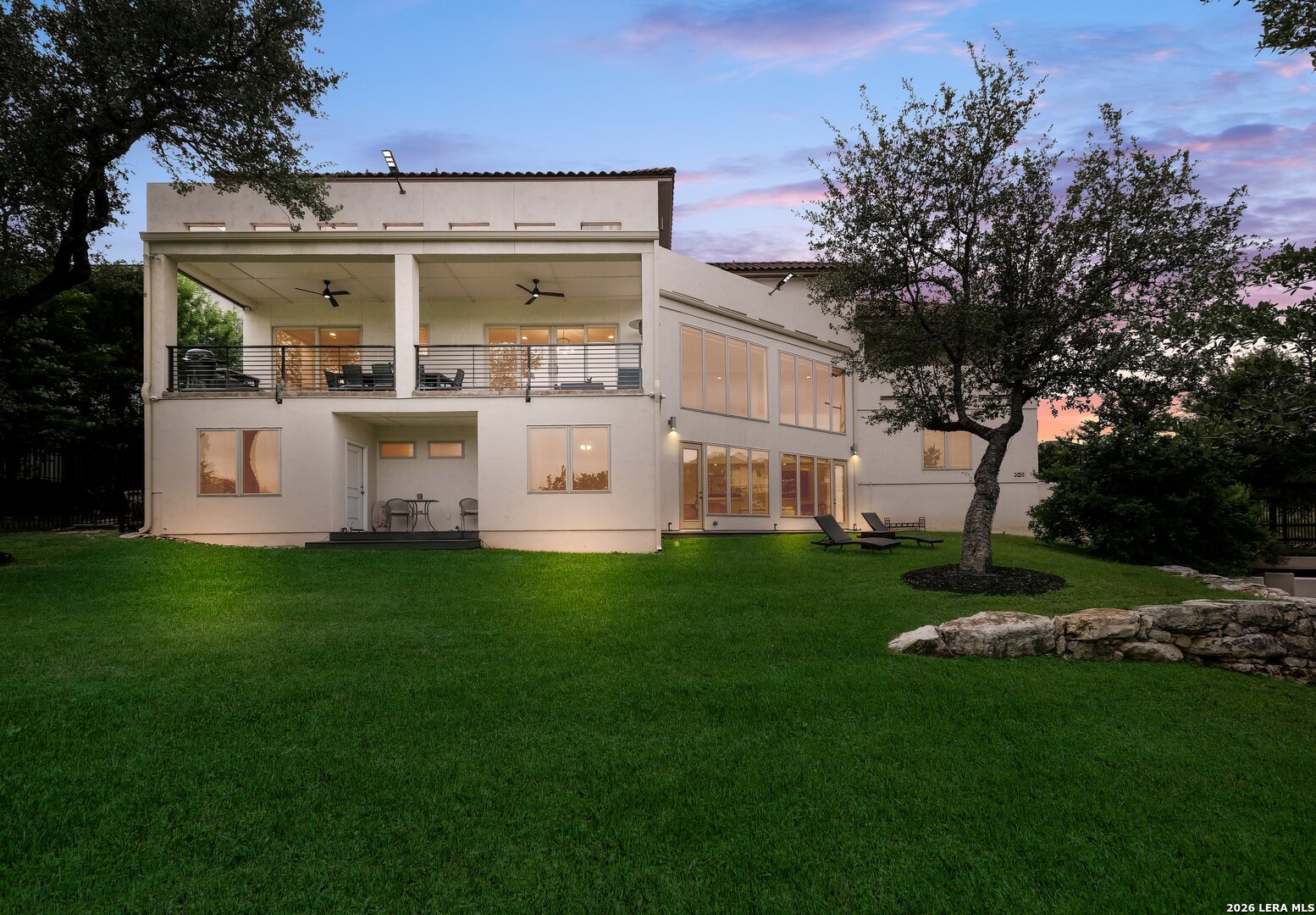 426 Legacy Ridge San Antonio, TX 78258 - Photo 35 of 38 a view of house with garden and tall trees
