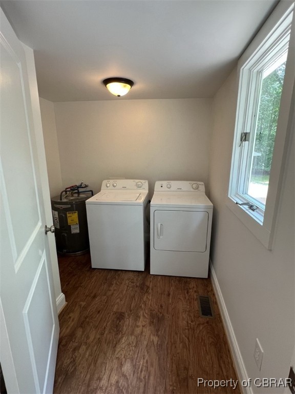 398 Philpot Road Locust Hill, VA 23092 - Photo 17 of 17 Laundry area with electric water heater, washer and dryer, dark wood-style floors, and healthy amount of natural light