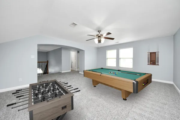 a bedroom with furniture and window