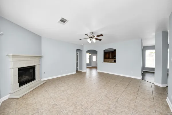 a view of an empty room with a fireplace