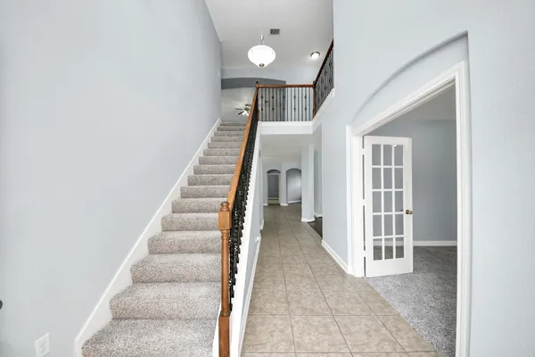 a view of a hallway with staircase
