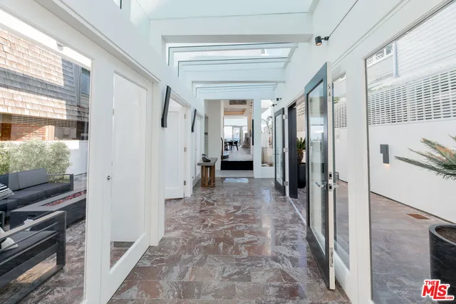 a view of a hallway with stairs
