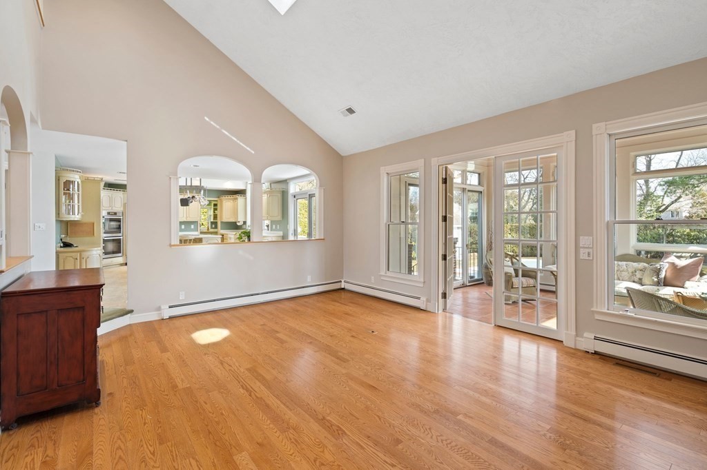 23 Louis Drive Wellesley, MA 02481 - Photo 12 of 42 a view of a livingroom with wooden floor and windows