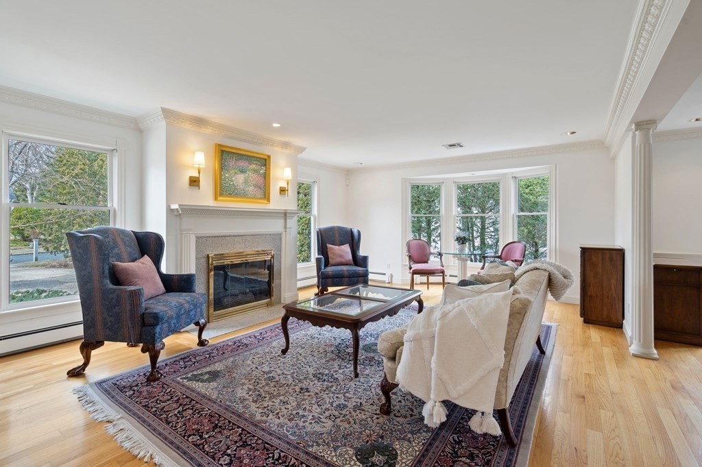 23 Louis Drive Wellesley, MA 02481 - Photo 13 of 42 a living room with furniture and a fireplace